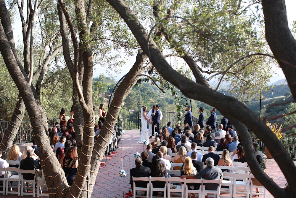 wedding ceremony through the trees