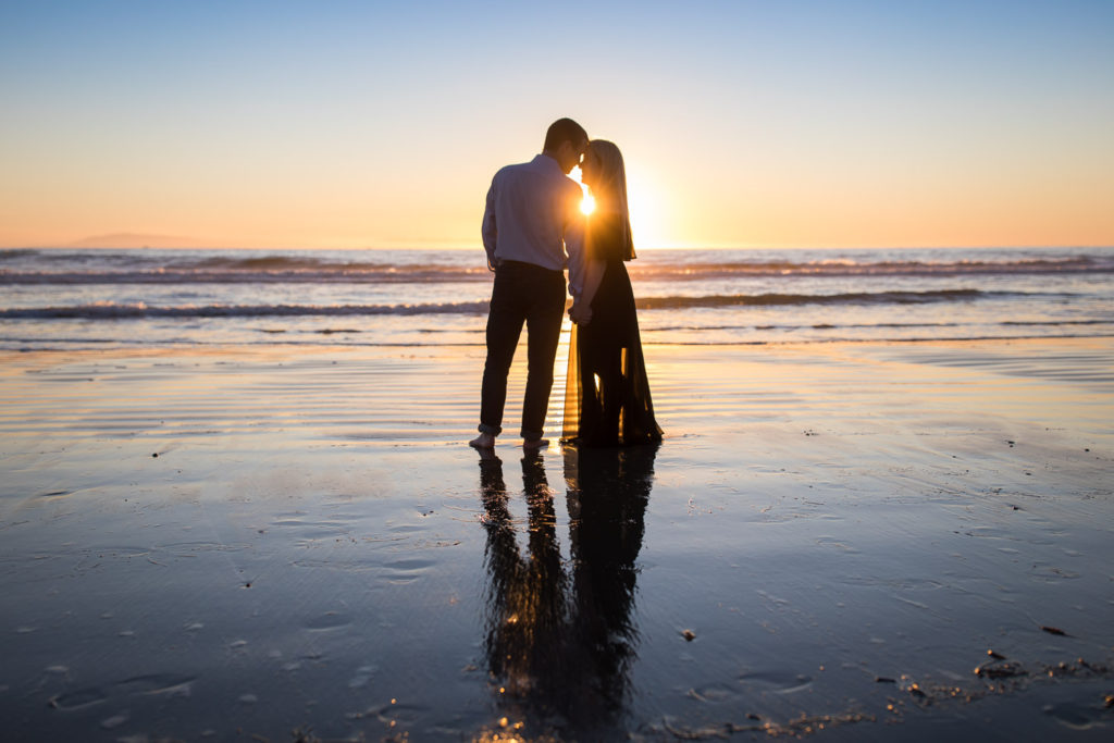 couple on ventura beach sunset
