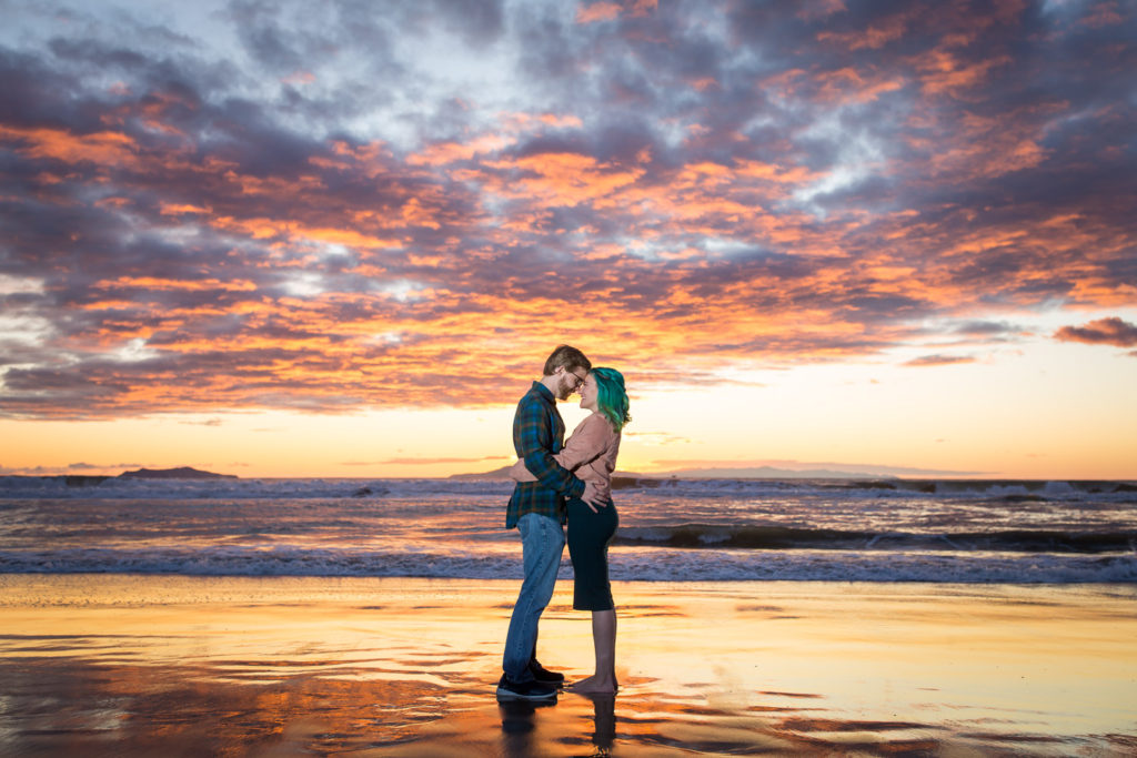 couple on the beach during sunset
