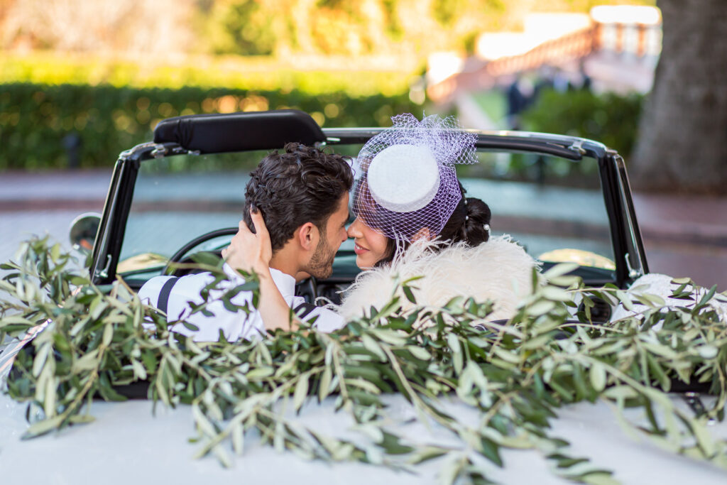 couple kissing in alfa romera car