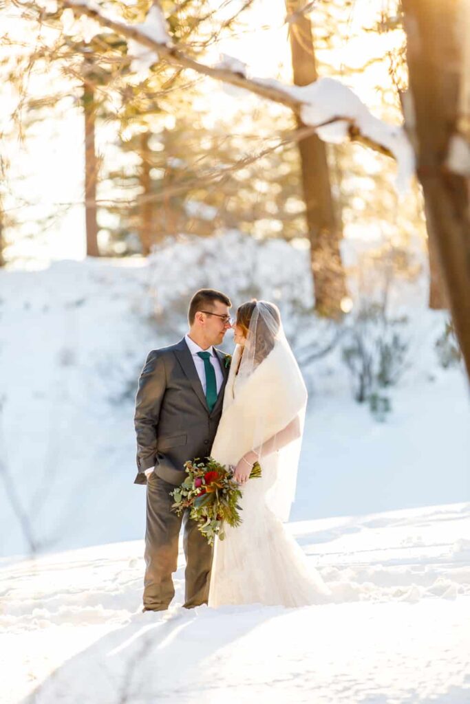 bride and groom in winter wonderland lake tahoe wedding