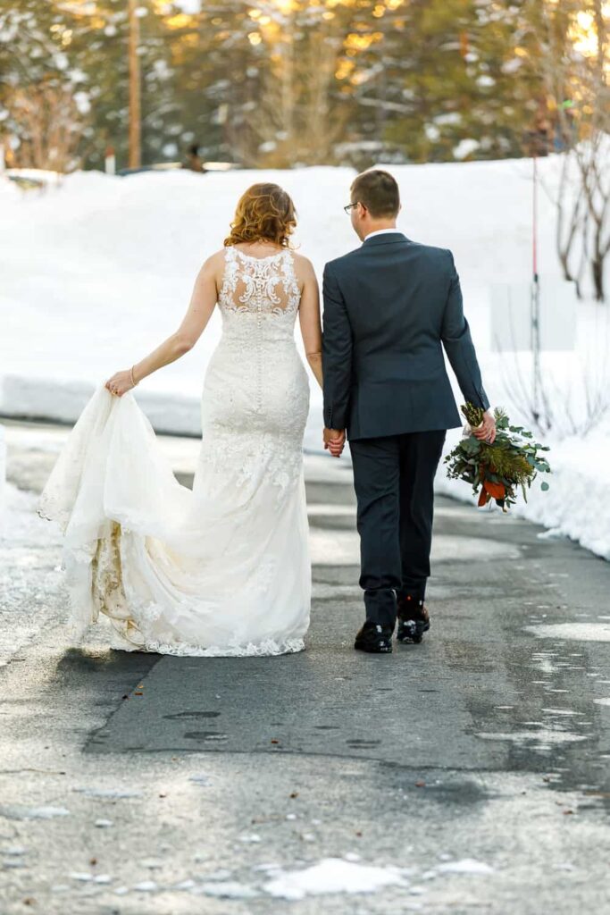 bride and groom walking lake tahoe wedding