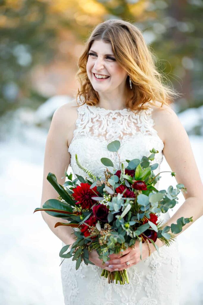 bride laughing holding bouquet lake tahoe wedding