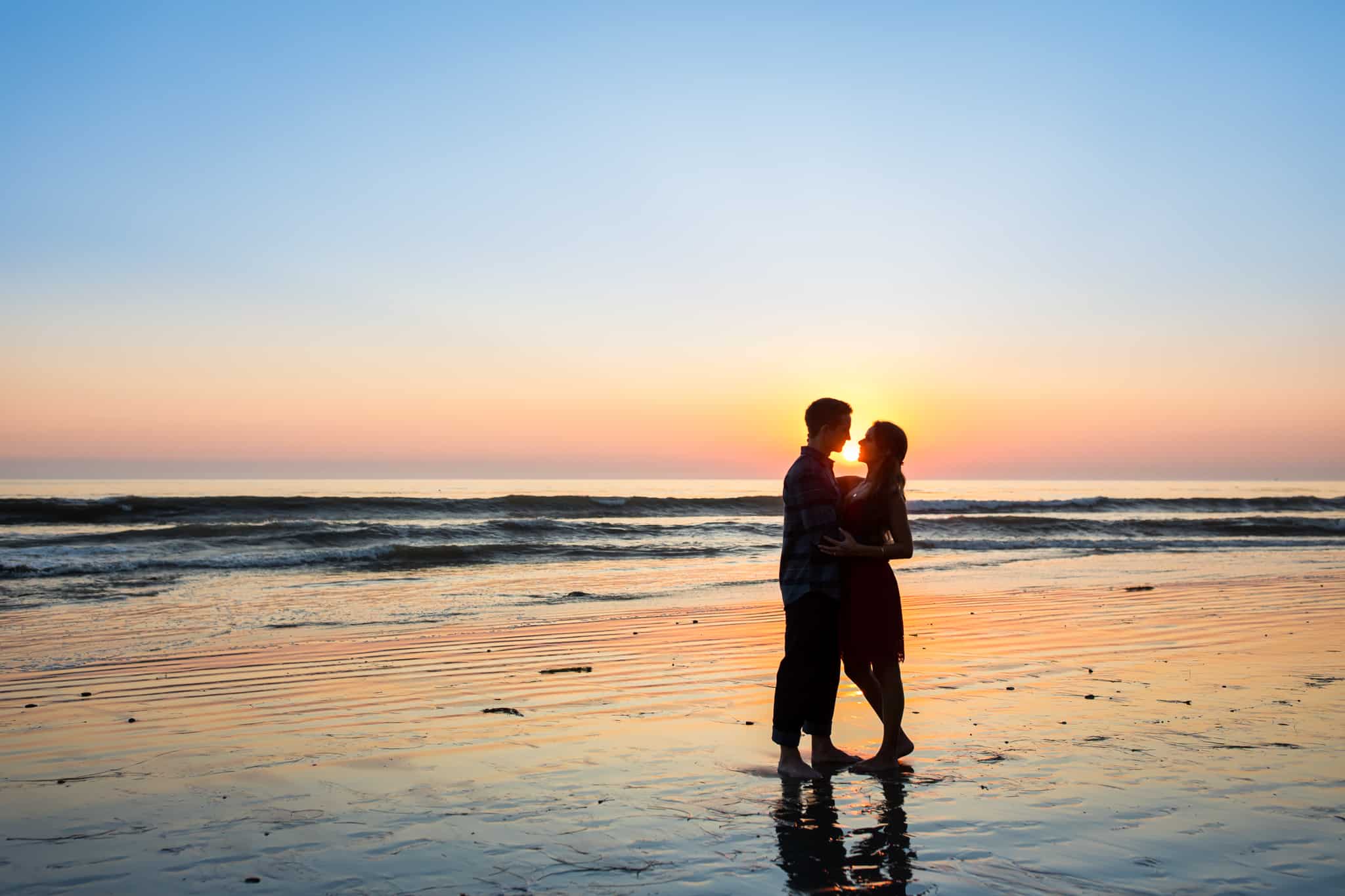 couple at sunset on the beach santa barbara engagement session