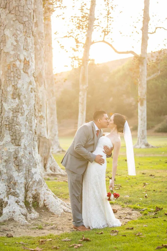 bride and groom kissing sunflare ventura park wedding