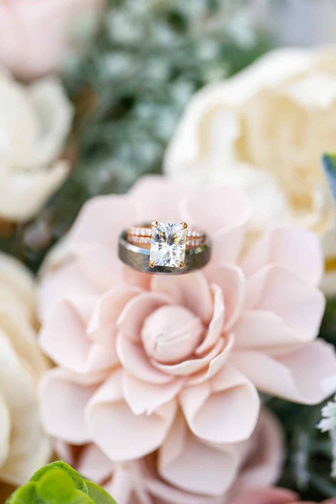closeup of diamond ring on wedding flowers