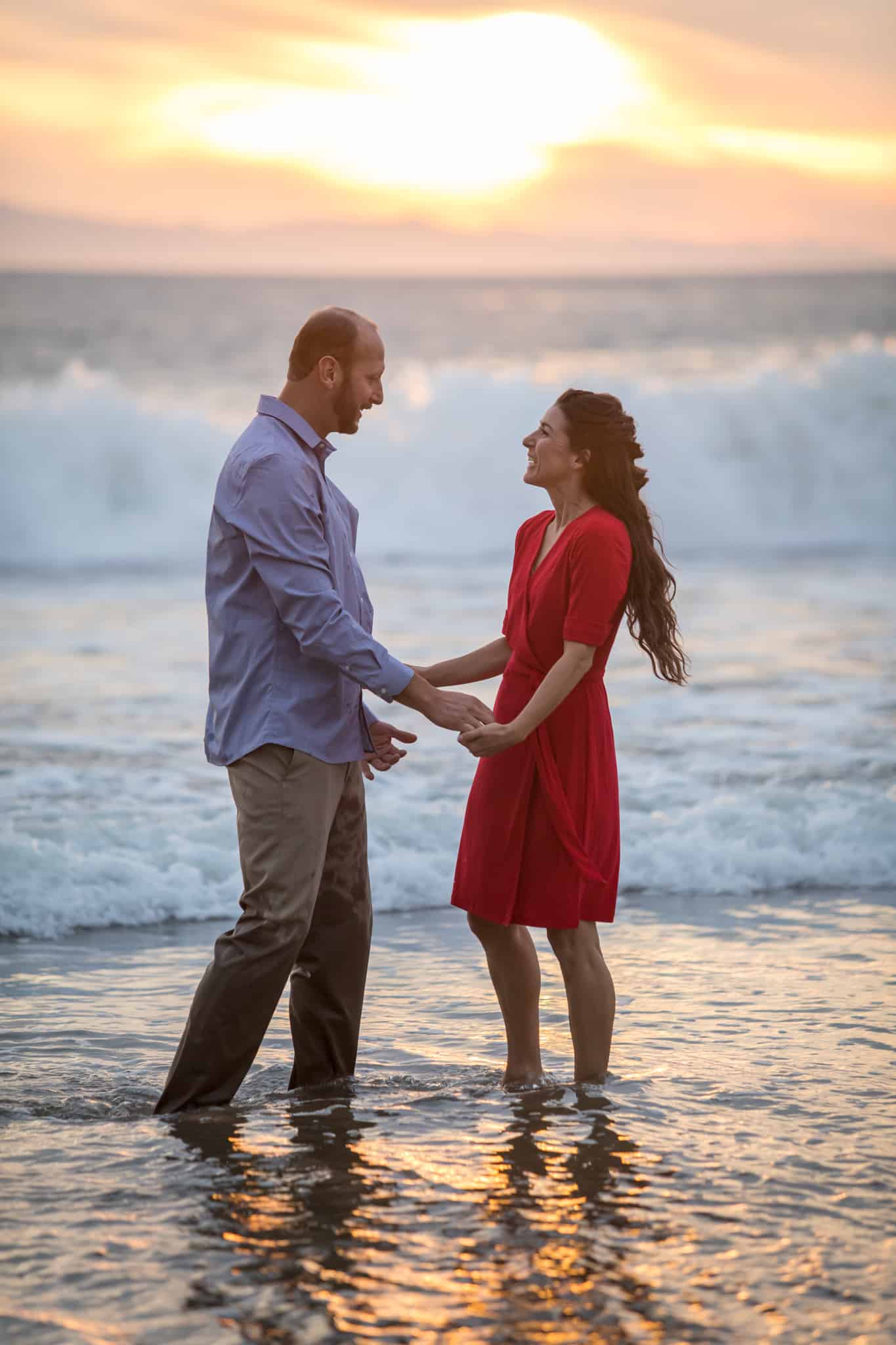 couple playing for their engagement session ventura beach