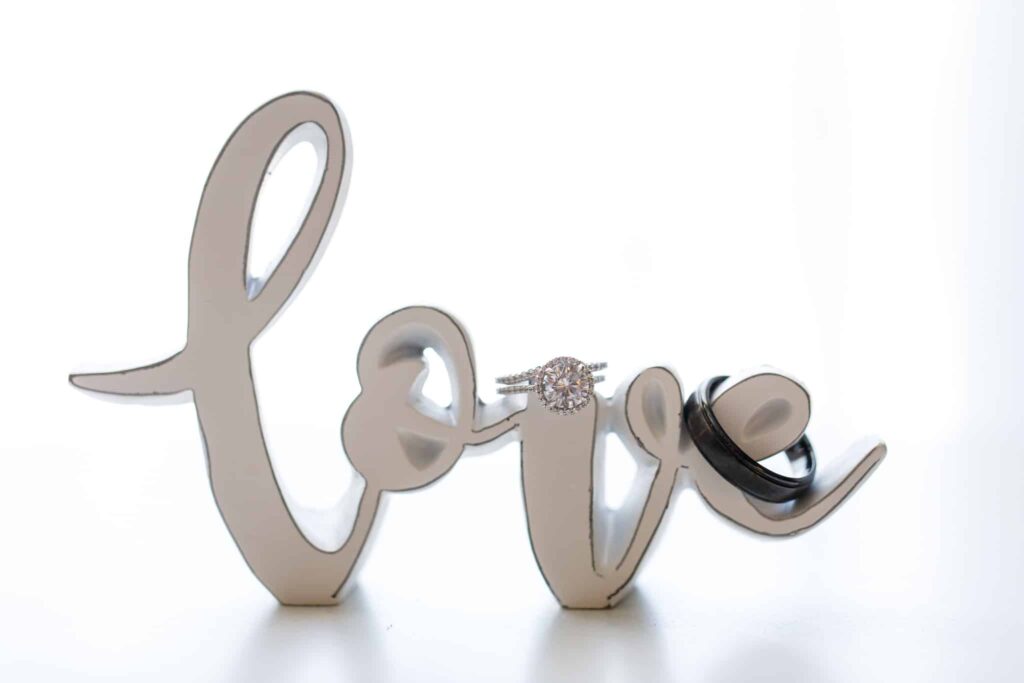 love display with wedding rings