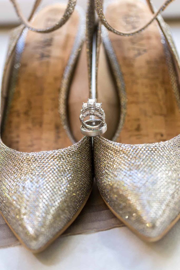 wedding rings on brides shoes