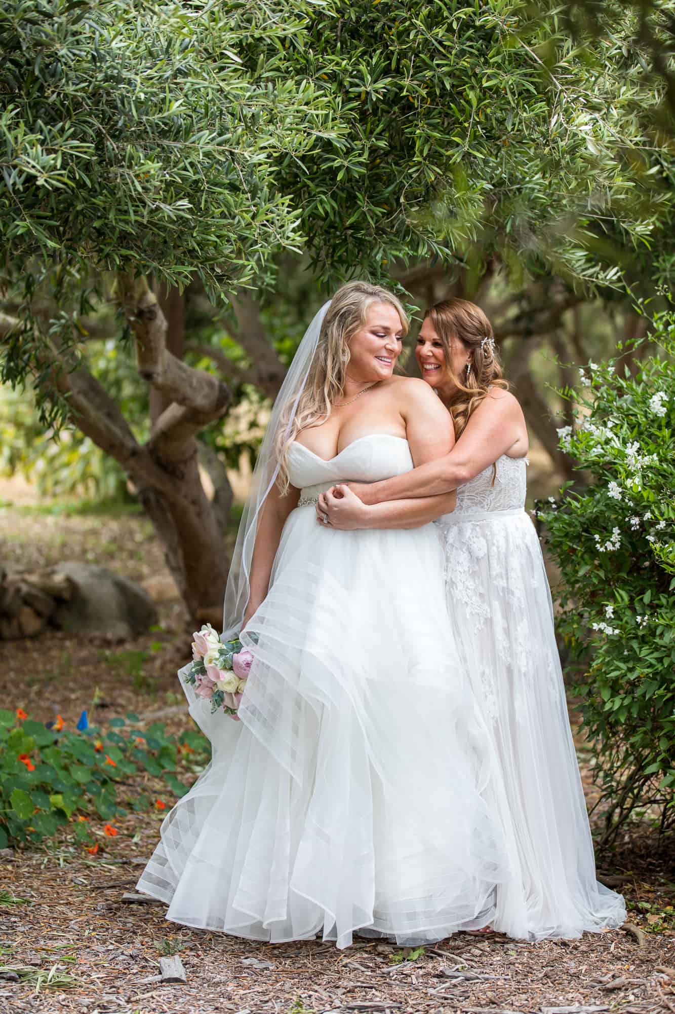 lesbian brides holding each other