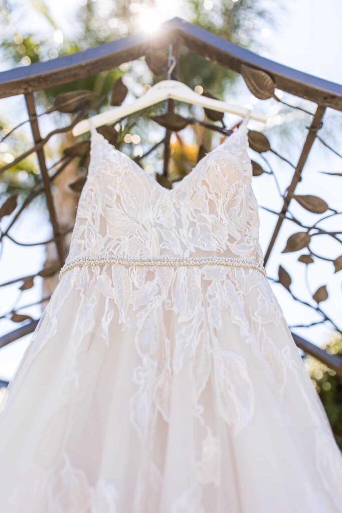 brides wedding dress hanging outside