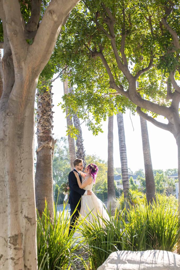 bride and groom portrait outside by trees