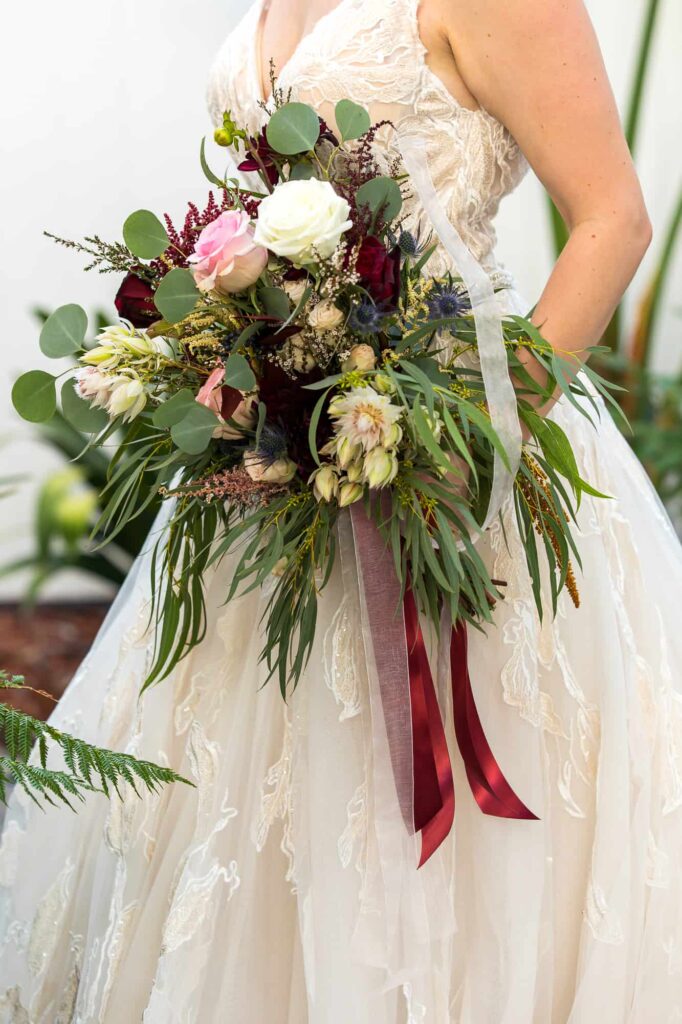 bride with her flower bouquet at her wedding