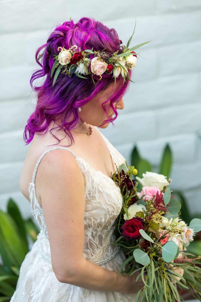 brides fuchsia hair with flower crown