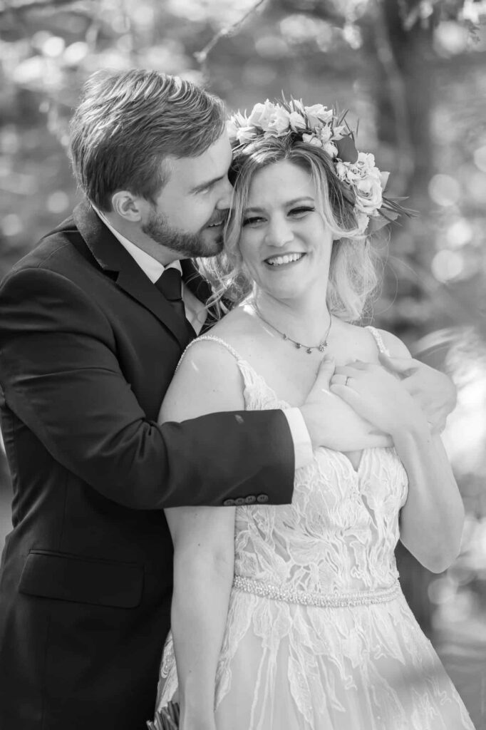 portrait of wedding couple laughing