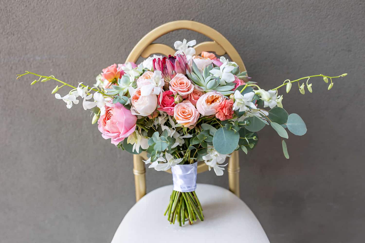 wedding bouquet with pink roses on a chair in santa barbara