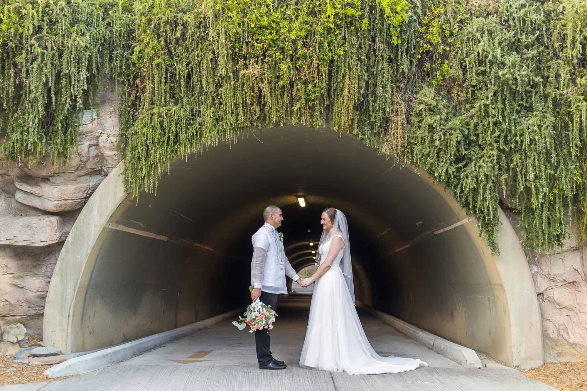 bride and groom by tunnel at glen ivy