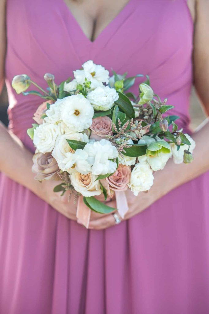 bridesmaid holding a floral bouquet