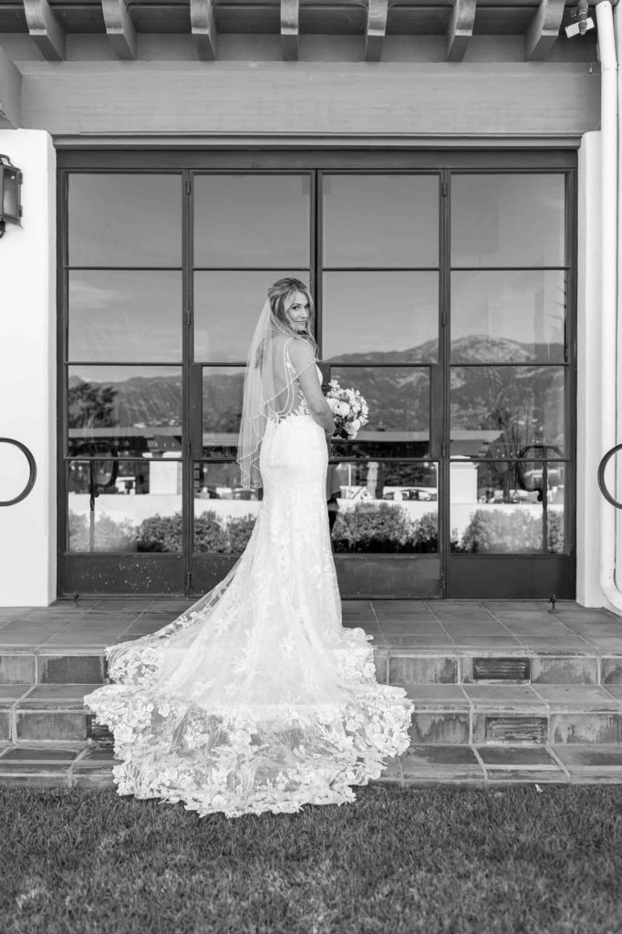 bride standing on stairs at la cumbre country club