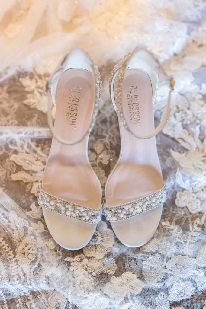 brides wedding shoes on lace