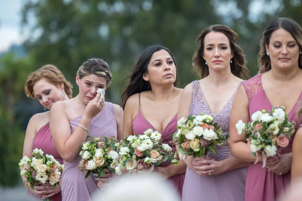 bridesmaids crying during wedding ceremony