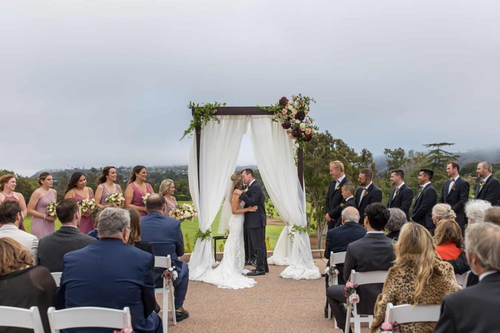bride and grooms first kiss at la cumbre country club