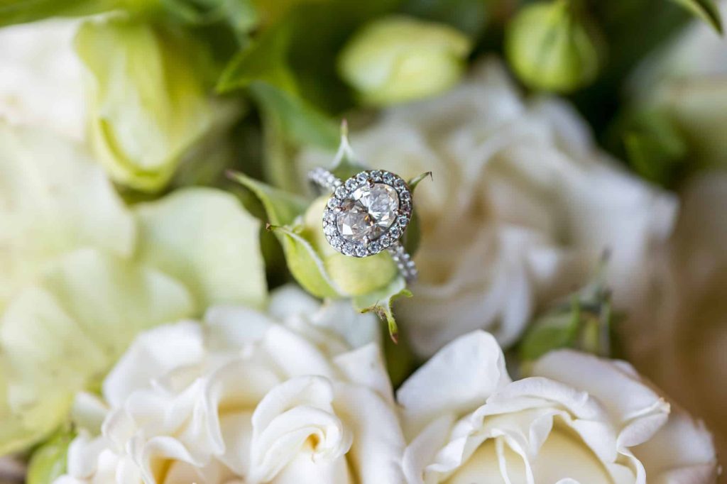 diamond engagement ring in white flowers