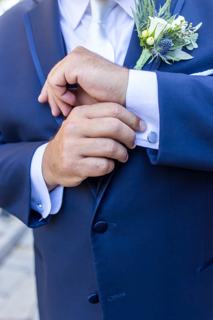 groom adjusting his cufflinks