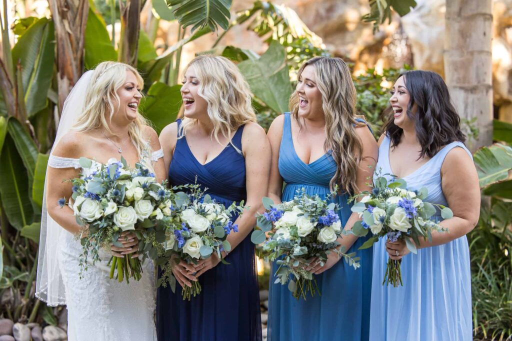 bride with her bridesmaids in blue
