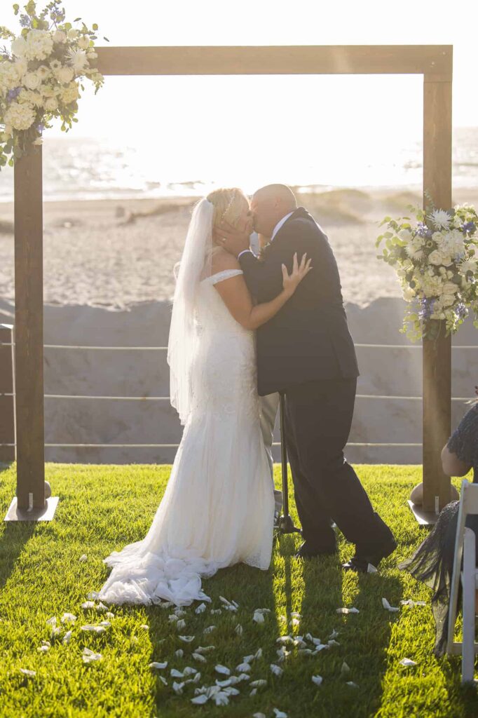 bride and grooms first kiss at zachari dunes