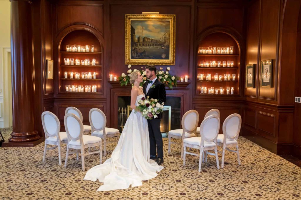 indoor ceremony space with romantic candles and white details at Sherwood Country Club in Thousand Oaks