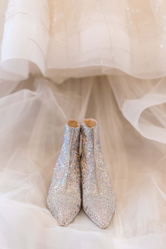 brides sparkly crystal wedding boots by her dress