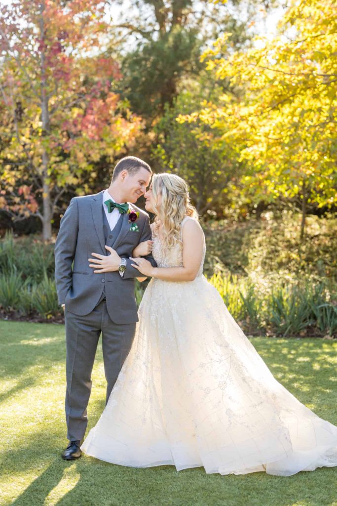 bride and groom together in the los robles greens gardens