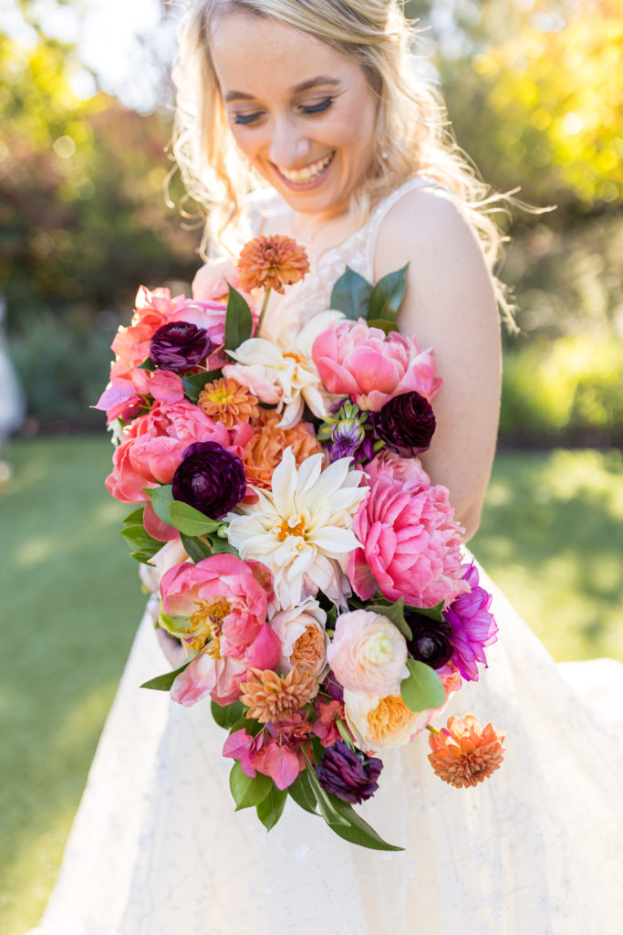 bride holding her bright colorful wedding bouquet