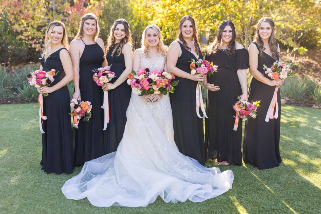 bride outside with her bridesmaids