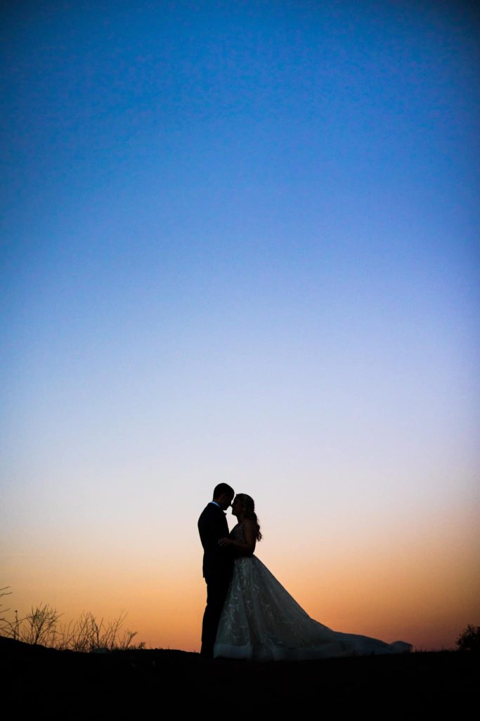 silhouette of bride and groom on their wedding