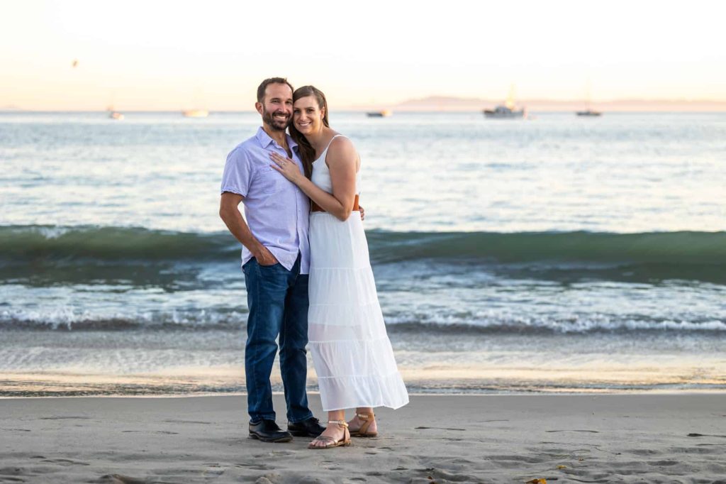 engaged couple standing in front of the Pacific ocean in Santa Barbara for their beach engagement photos capture by California wedding photographer