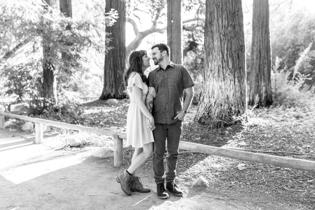 black and white image of man and woman posing for their Botanical Gardens engagement session