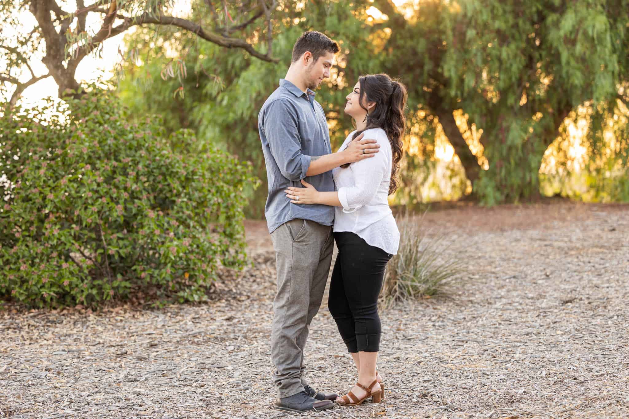 Conejo Botanical Gardens engagment photos withman and woman embracing each other in the woods