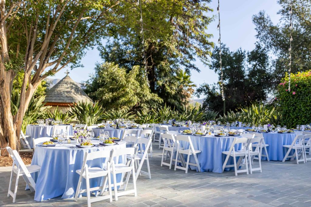 outdoor wedding reception tables in a courtyard at a Victorian Mansion photographed by Ventura County wedding photographer