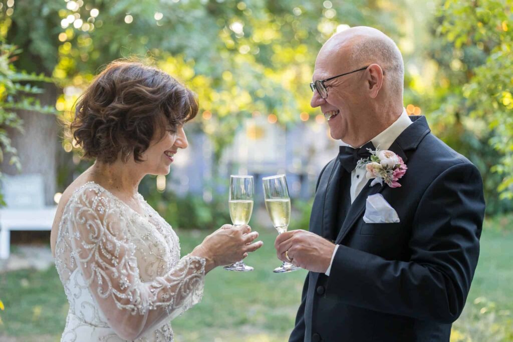 bride and groom toasting each other for their outdoor wedding at the Lavender Inn in Ojai with Ventura wedding photographer