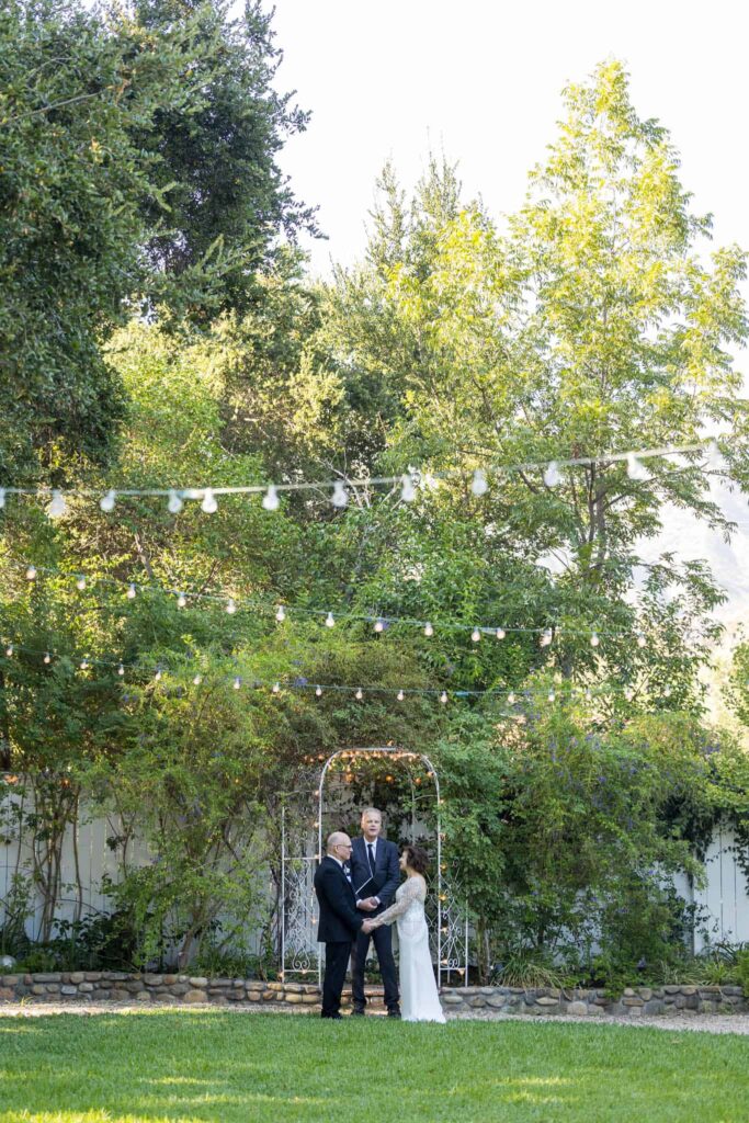 Ventura County wedding photographer captured bride and groom saying their vows at the lavender inn ojai during their elopement