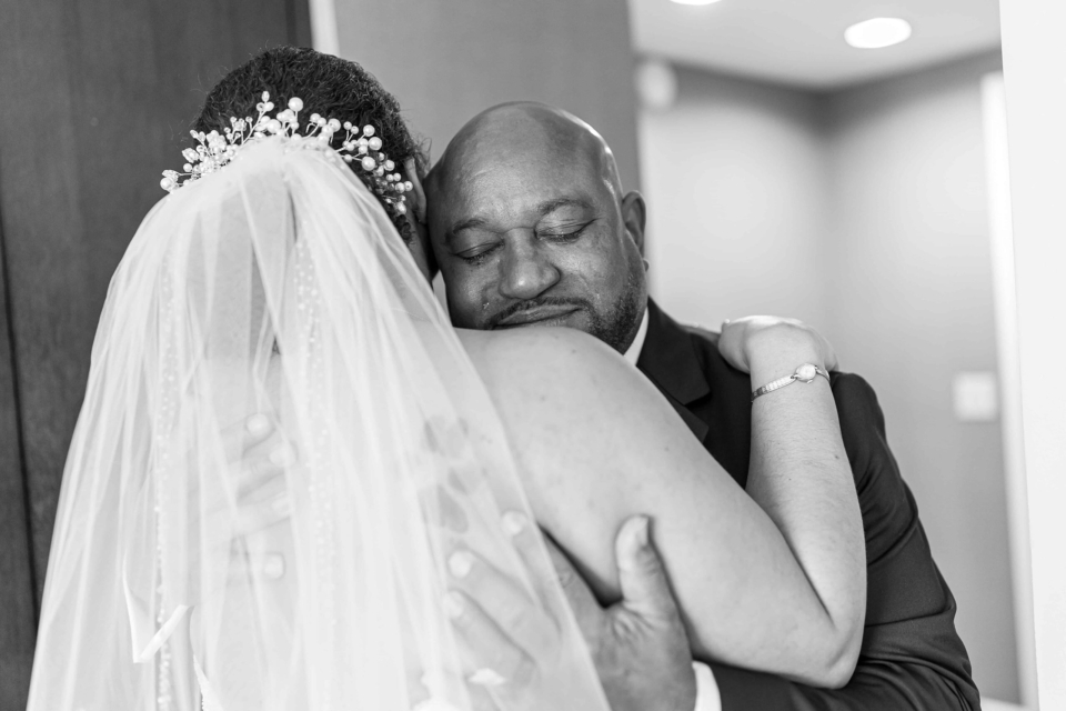 emotional father hugging bride on her wedding day at westlake village inn