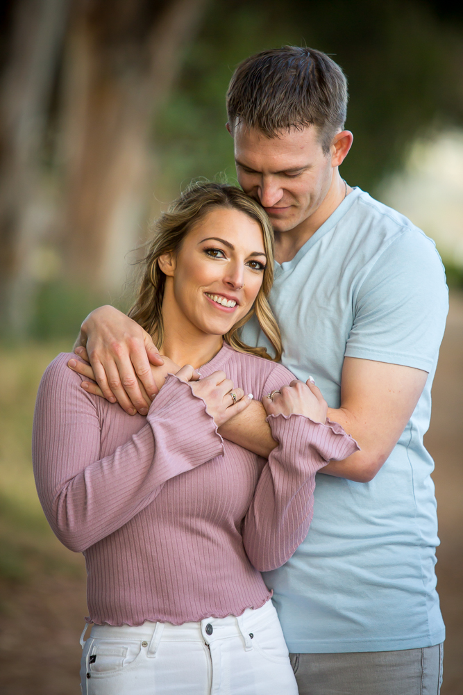 couple holding each other engagement session carpinteria bluffs