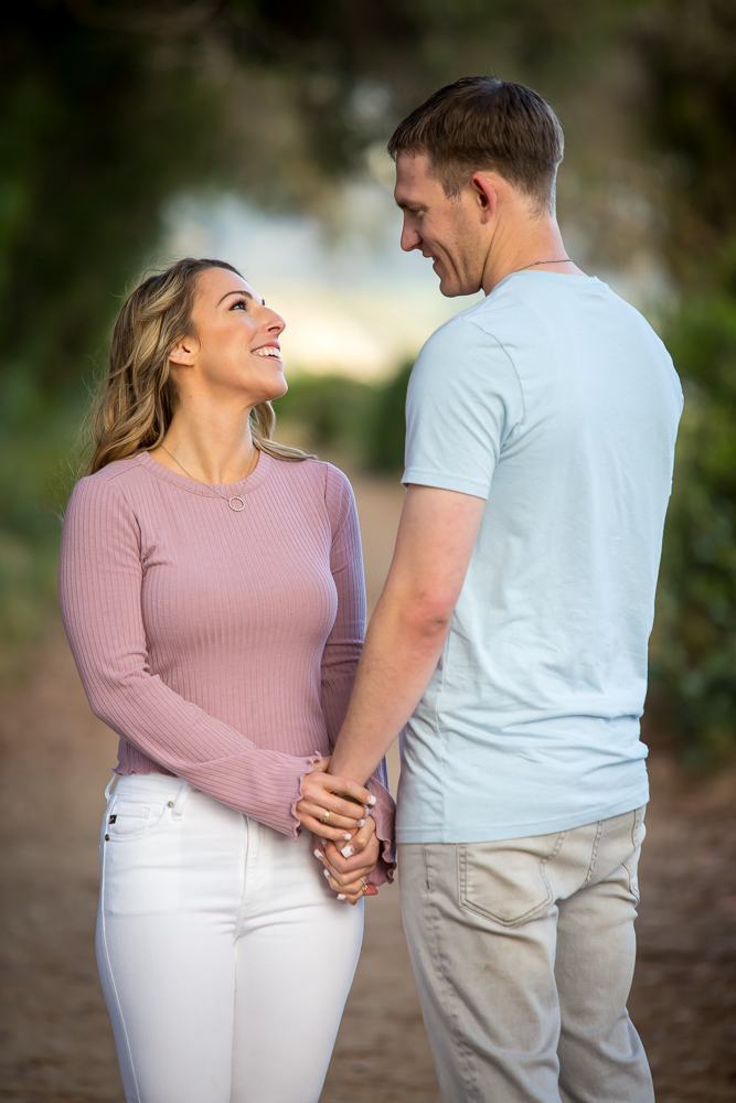 couple holding hands engagement session carpinteria bluffs