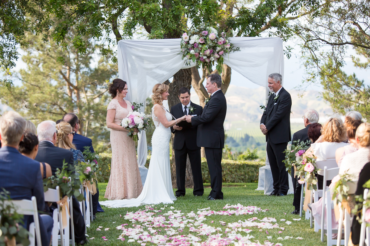 bride and groom at the alter Spanish hills country club wedding