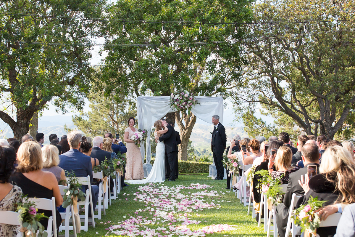 bride and groom first kiss Spanish hills country club wedding