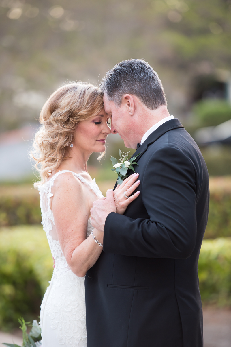 bride and groom embracing Spanish hills country club wedding
