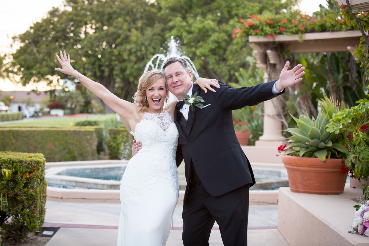 bride and groom happily raising arms Spanish hills country club wedding