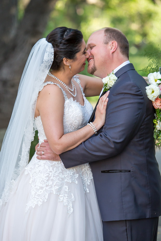 bride groom kissing wedding photography